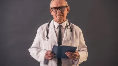 depositphotos 198441490 stock photo handsome old doctor medical coat.webp